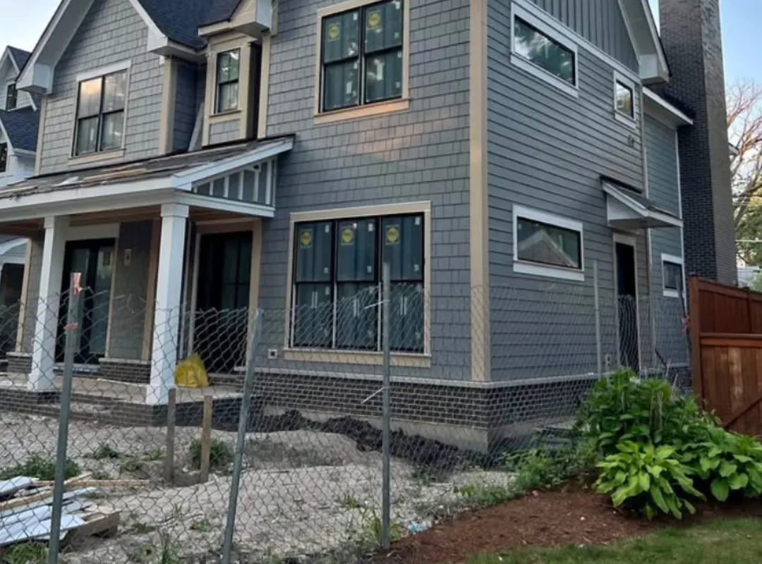 Newly installed fiber cement and shake siding on a two-story Eau Claire, WI home